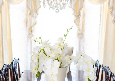 Close up of grand chandelier above dining room table